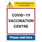 COVID-19 Vaccination Centre - Please Wait Here
