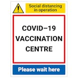 COVID-19 Vaccination Centre - Please Wait Here